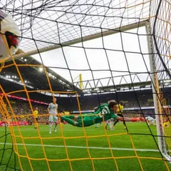 European football: Dortmund win again but Freiburg top after Gladbach rout