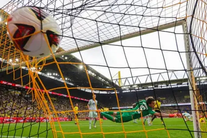 European football: Dortmund win again but Freiburg top after Gladbach rout